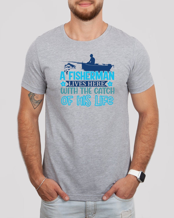 A fisherman lives here with the catch of his life med gray t-shirt
