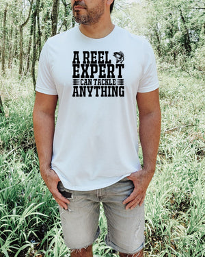 A reel expert can tackle anything black lettering white t-shirt