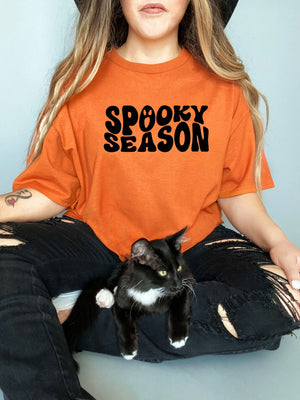 Spooky Season face on Gildan orange t-shirt