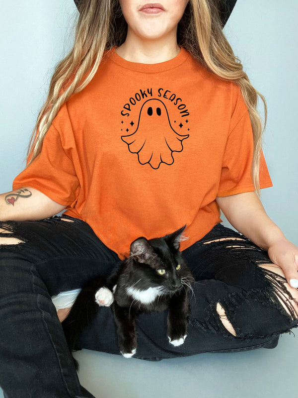 Spooky season ghost chilling on Gildan orange t-shirt