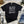 Load image into Gallery viewer, Halloween list white on Gildan Black T-Shirt
