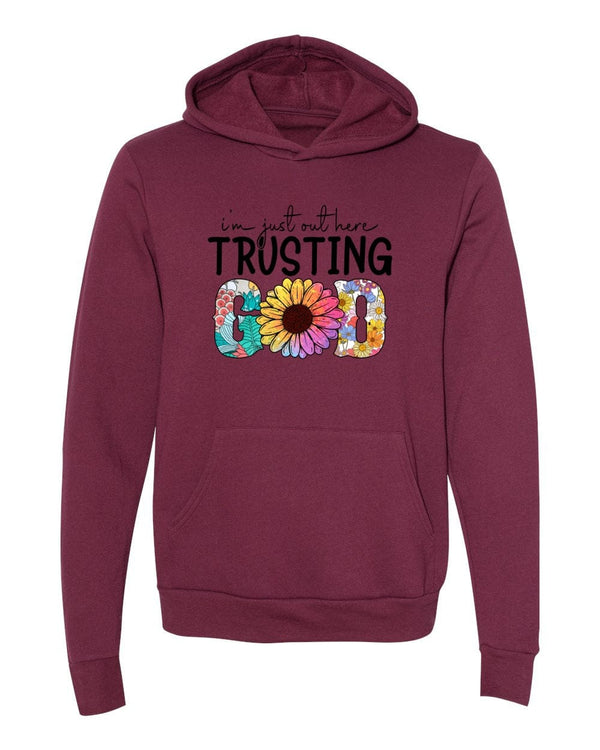 I'm just out here trusting God maroon Hoodies